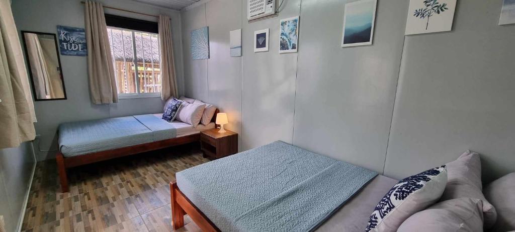 Postel nebo postele na pokoji v ubytování Olive Hostel Roxas City