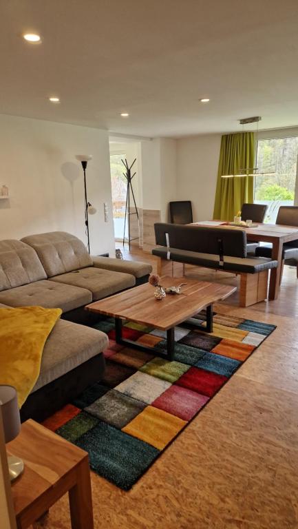 a living room with a couch and a coffee table at Ferienwohnung Vier Pfoten in Willingen