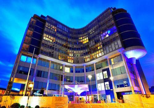 a large building with lights in front of it at Rafayel Hotel & Spa in London