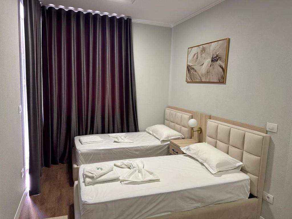 Postel nebo postele na pokoji v ubytování Hotel Dollari