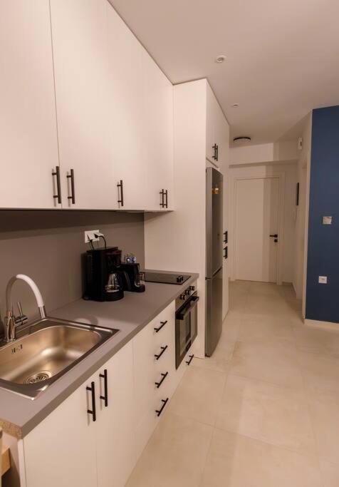 Kuchyň nebo kuchyňský kout v ubytování Sunrise Haven Suite