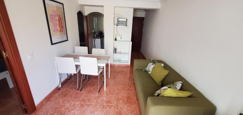 a living room with a couch and a table at Apartamento Fuengirola Centro in Fuengirola