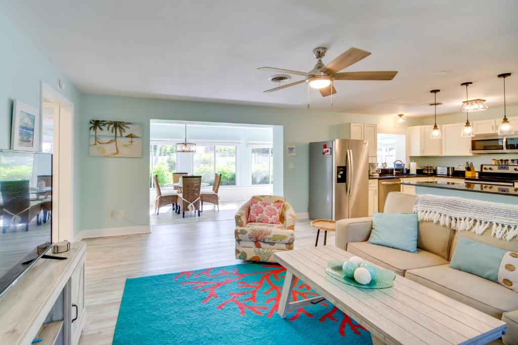 a living room with a couch and a table at Dog-Friendly Vero Beach Home Less Than 7 Mi to Coast! in Vero Beach