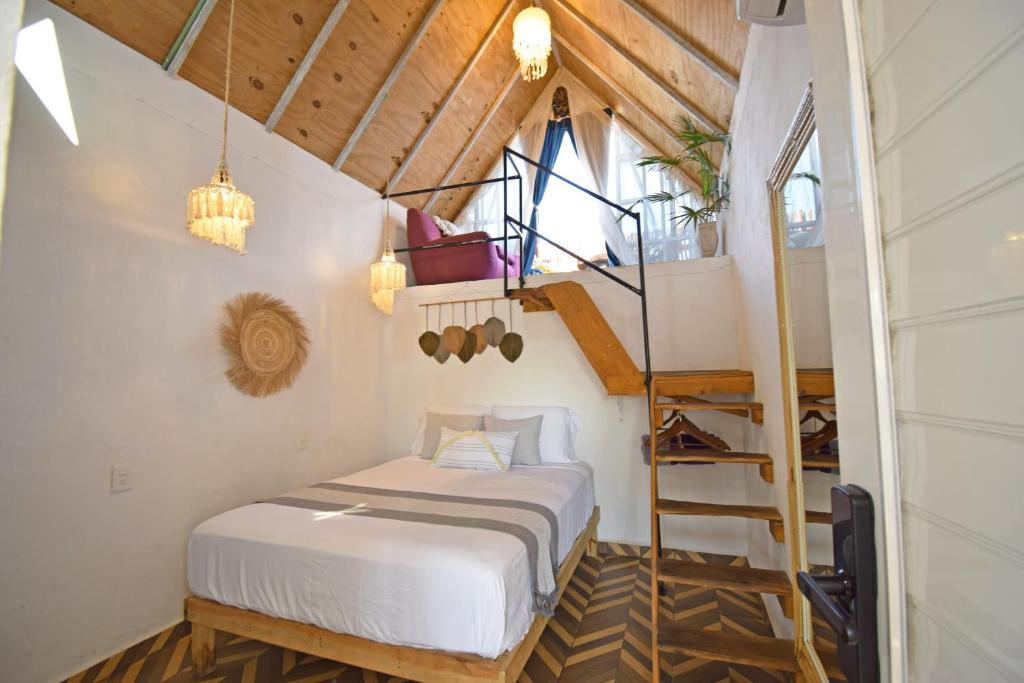 Postel nebo postele na pokoji v ubytování Bungalow Maya en CASA NOMIS CANCUN