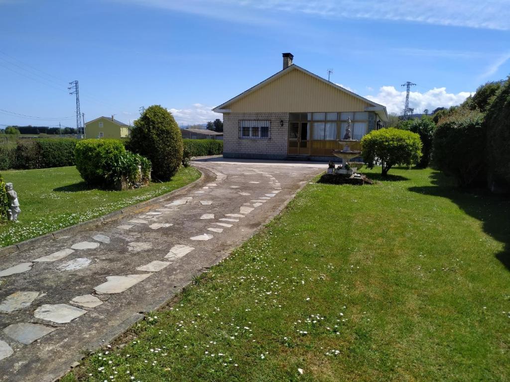 a house with a road in front of it at Villa Sara in Ribadeo