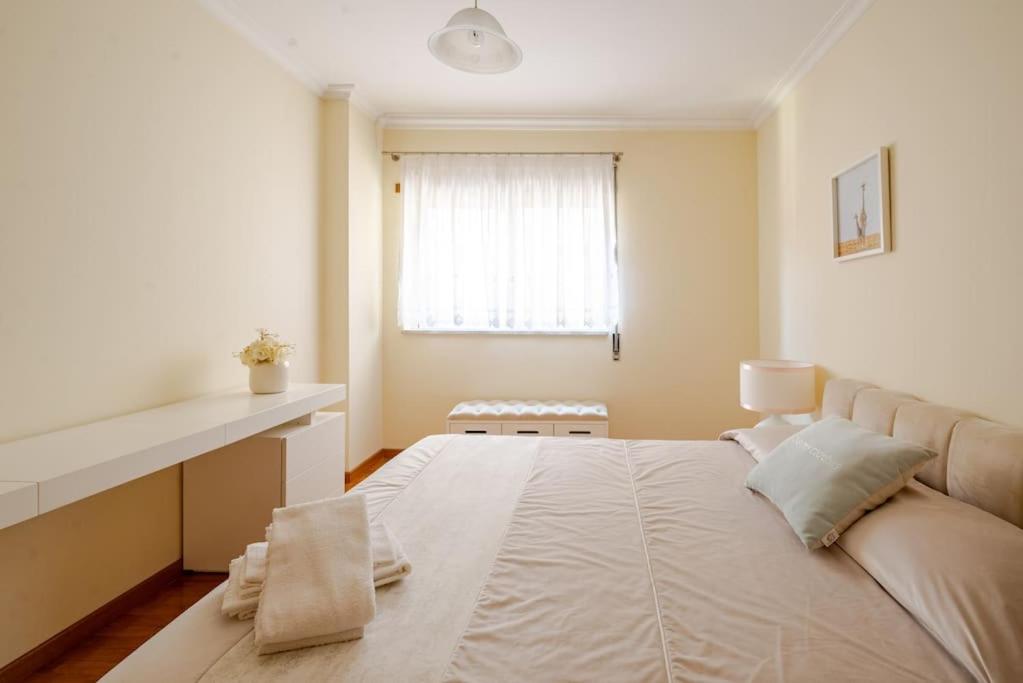 Postel nebo postele na pokoji v ubytování Remédios Apartment