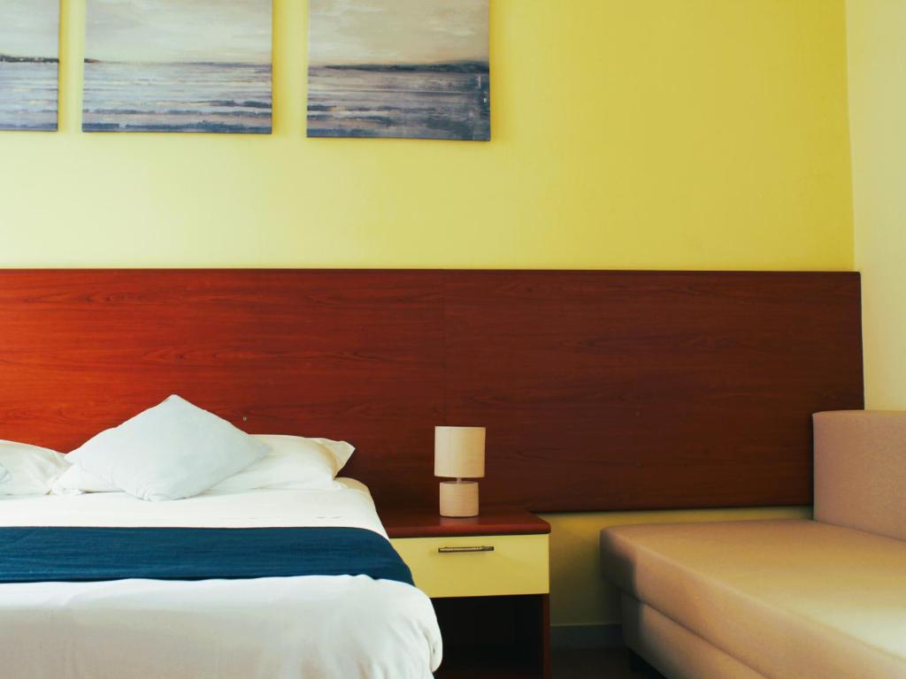Postel nebo postele na pokoji v ubytování Hotel Panoramico