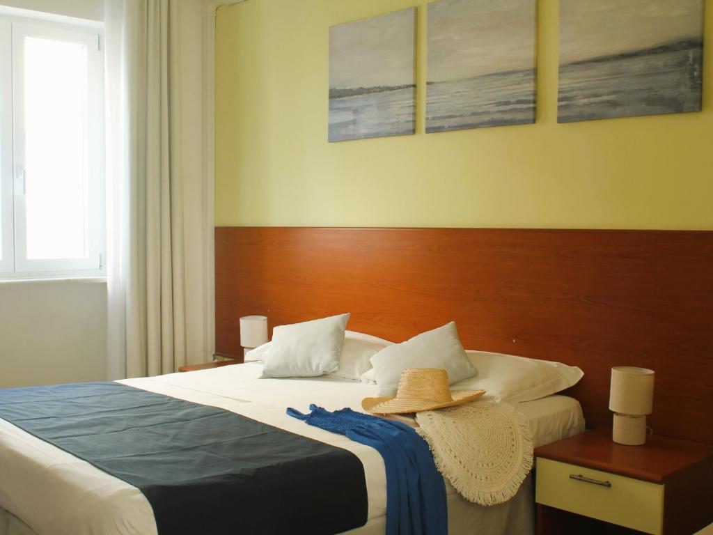 Postel nebo postele na pokoji v ubytování Hotel Panoramico
