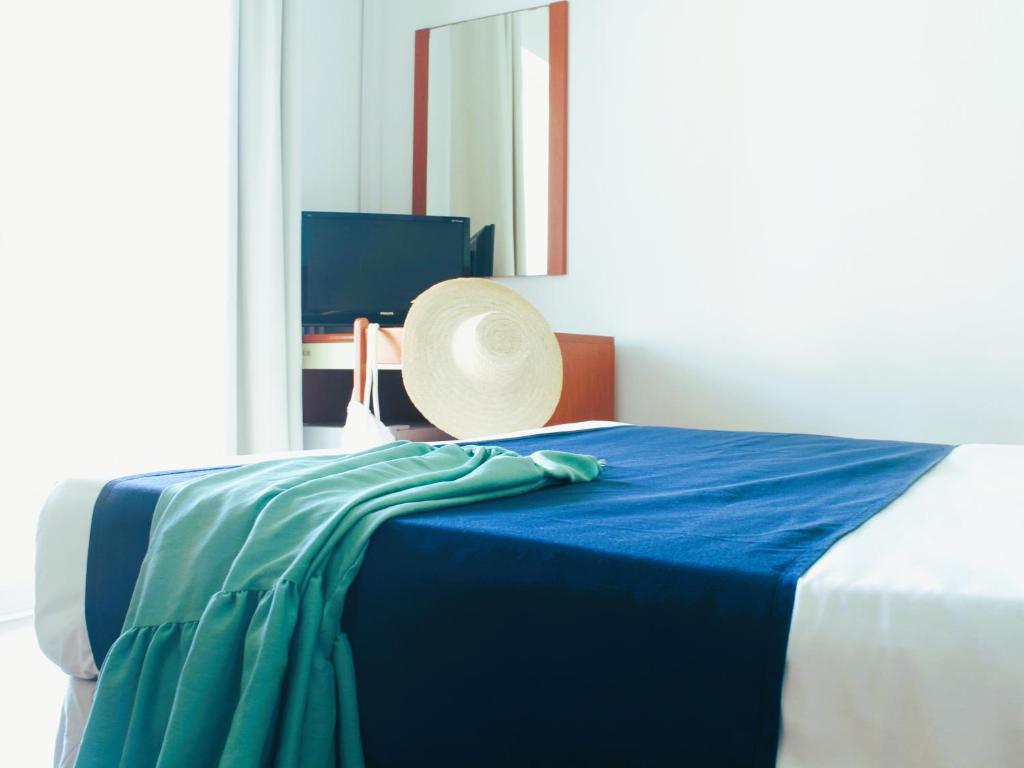 Postel nebo postele na pokoji v ubytování Hotel Panoramico