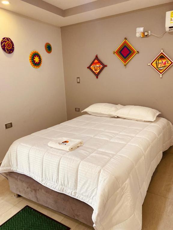 Postel nebo postele na pokoji v ubytování Hotel Alikaa Wayira