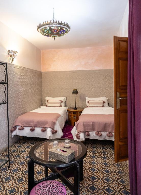 Postel nebo postele na pokoji v ubytování Riad Zayane Atlas