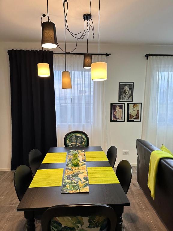 a dining room with a table and chairs at Košava in Golubac