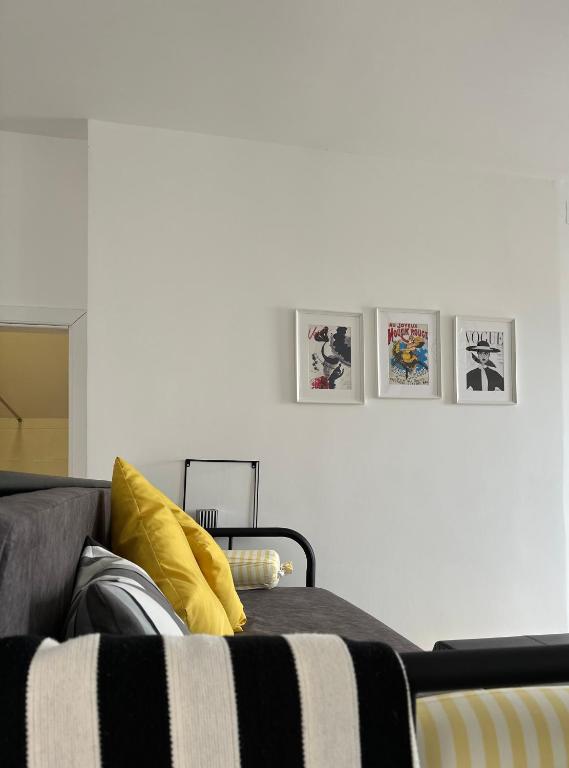 a living room with a couch and a yellow pillow at Košava in Golubac