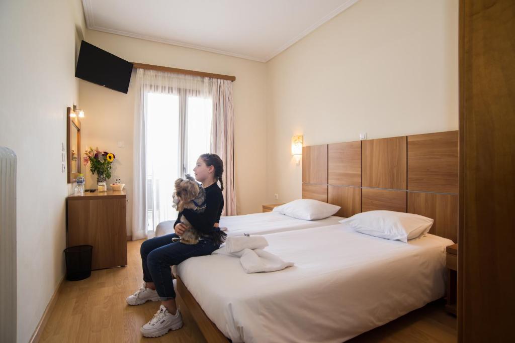Postel nebo postele na pokoji v ubytování THOLOS HOTEL