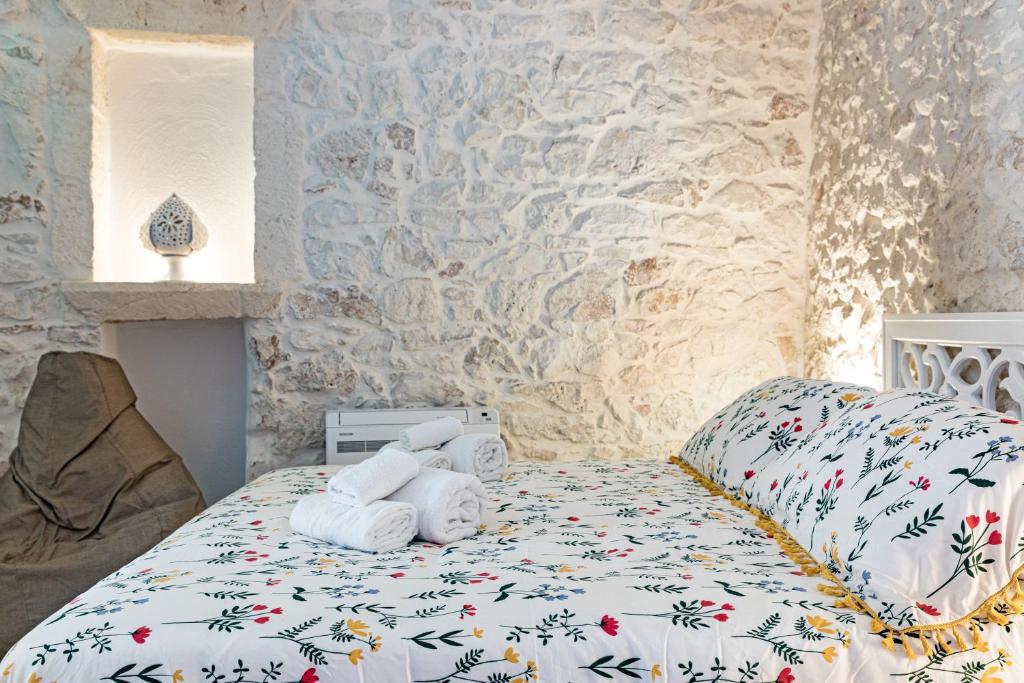 Postel nebo postele na pokoji v ubytování Luxury Suite Of Ostuni