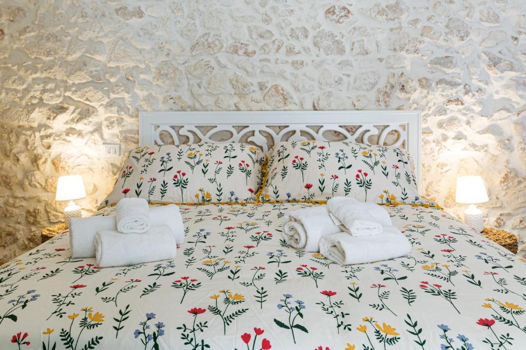 Postel nebo postele na pokoji v ubytování Luxury Suite Of Ostuni