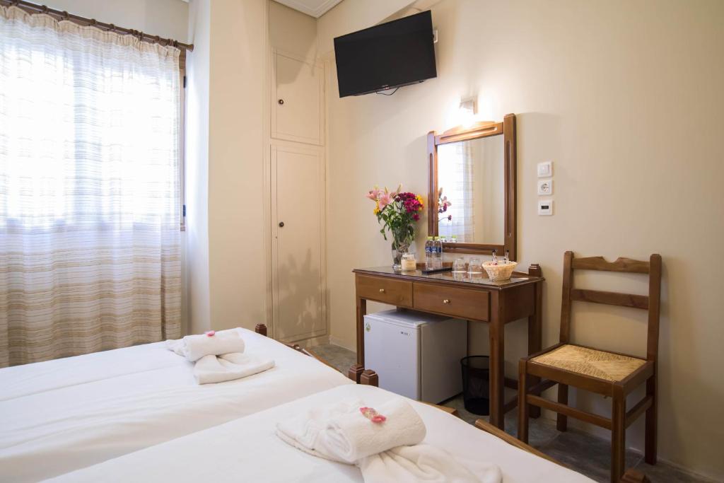 Postel nebo postele na pokoji v ubytování THOLOS HOTEL