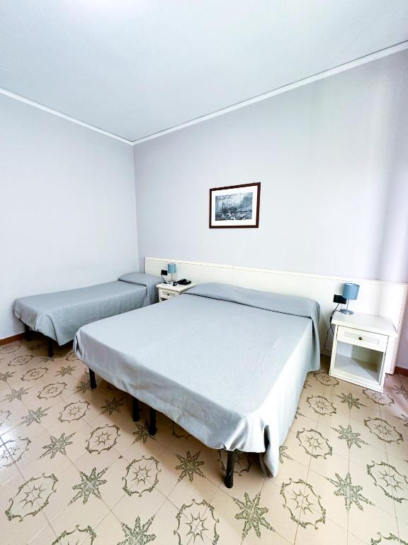 Postel nebo postele na pokoji v ubytování Hotel Europa