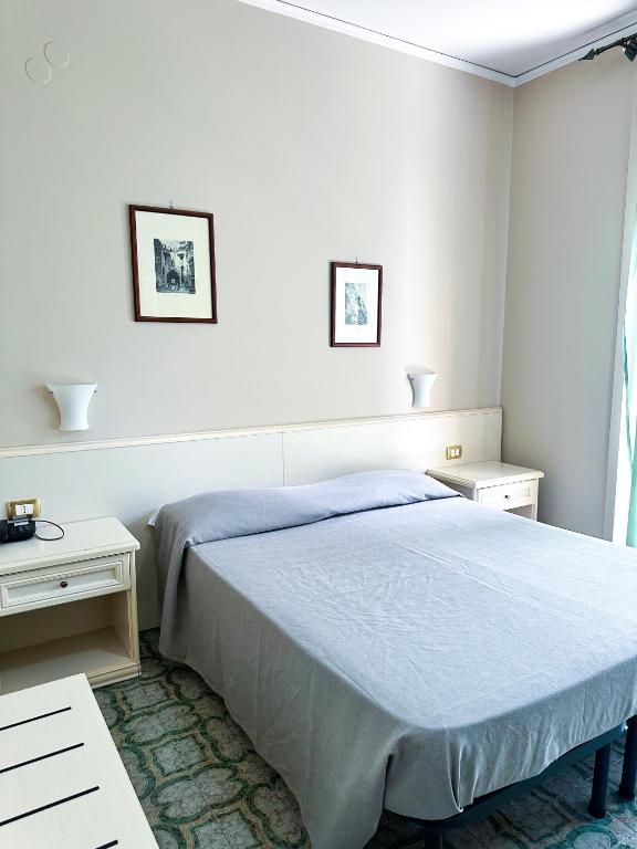 Postel nebo postele na pokoji v ubytování Hotel Europa