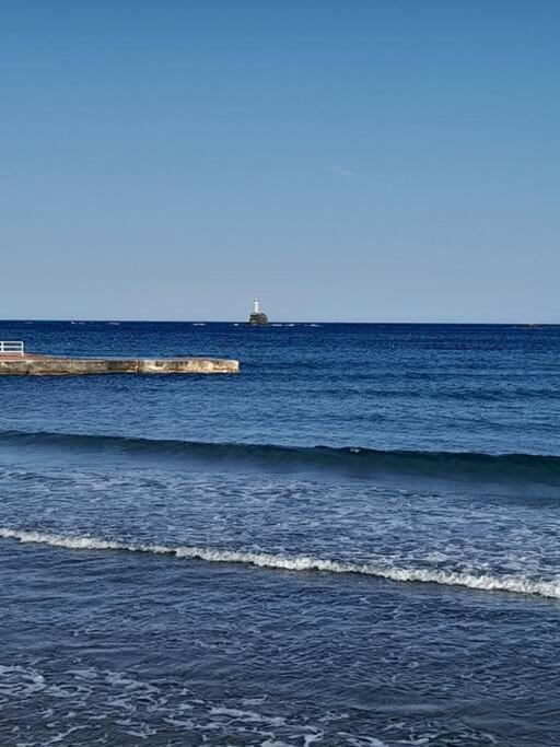 a large body of water with waves in the ocean at Andros Escape Chora in Andros