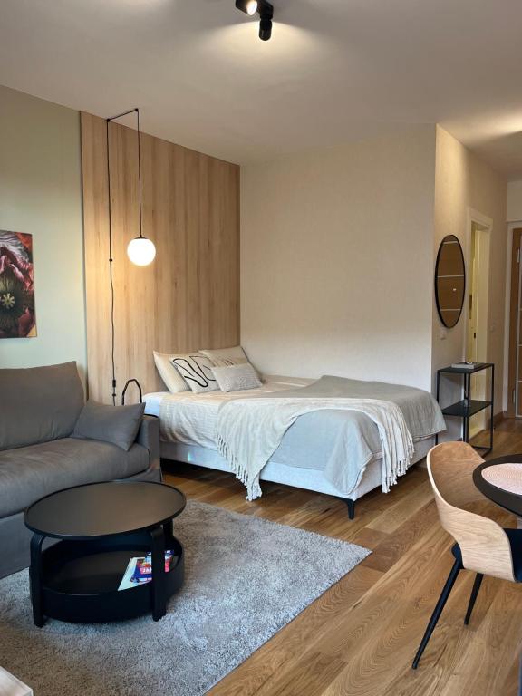 Ένα ή περισσότερα κρεβάτια σε δωμάτιο στο IVA HOME Apartment