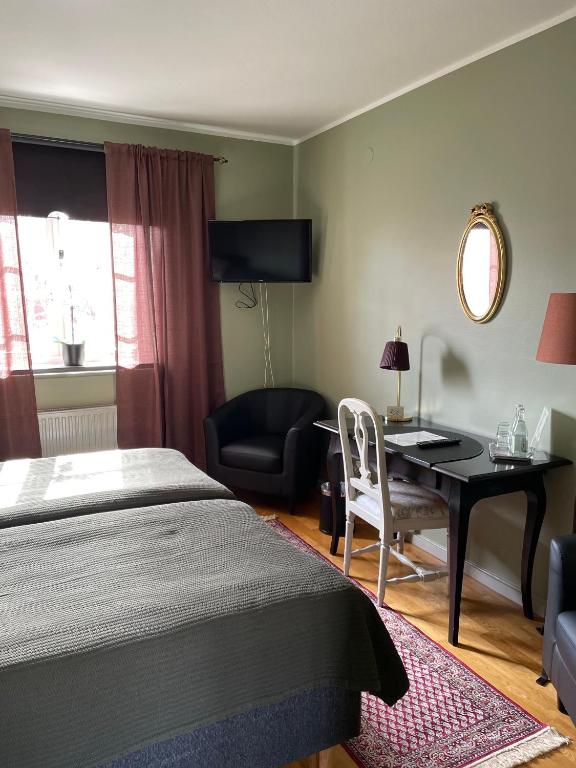 Postel nebo postele na pokoji v ubytování Hotell Laurentius
