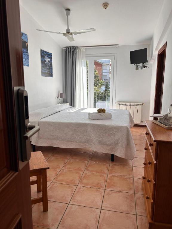 Postel nebo postele na pokoji v ubytování Hotel Can Pepin