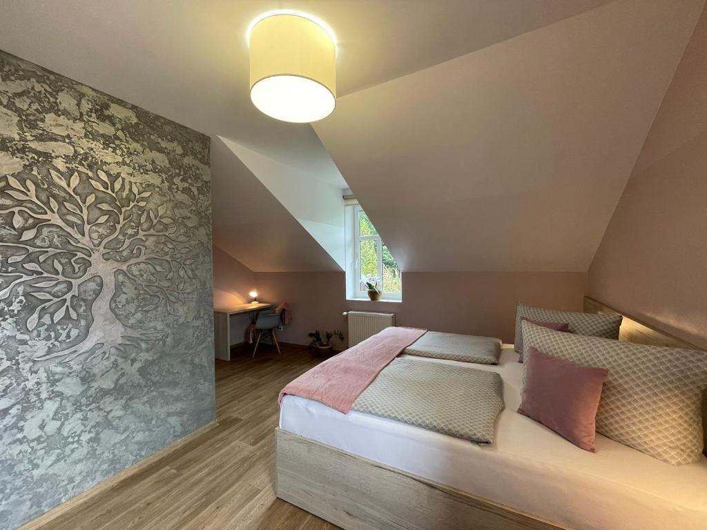 Postel nebo postele na pokoji v ubytování Apartmány Jasmín