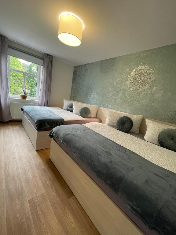 Postel nebo postele na pokoji v ubytování Apartmány Jasmín