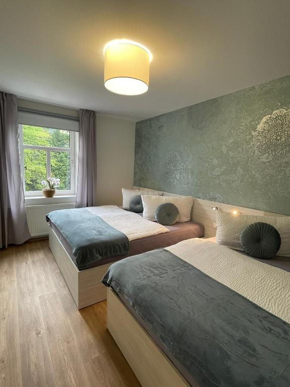 Postel nebo postele na pokoji v ubytování Apartmány Jasmín