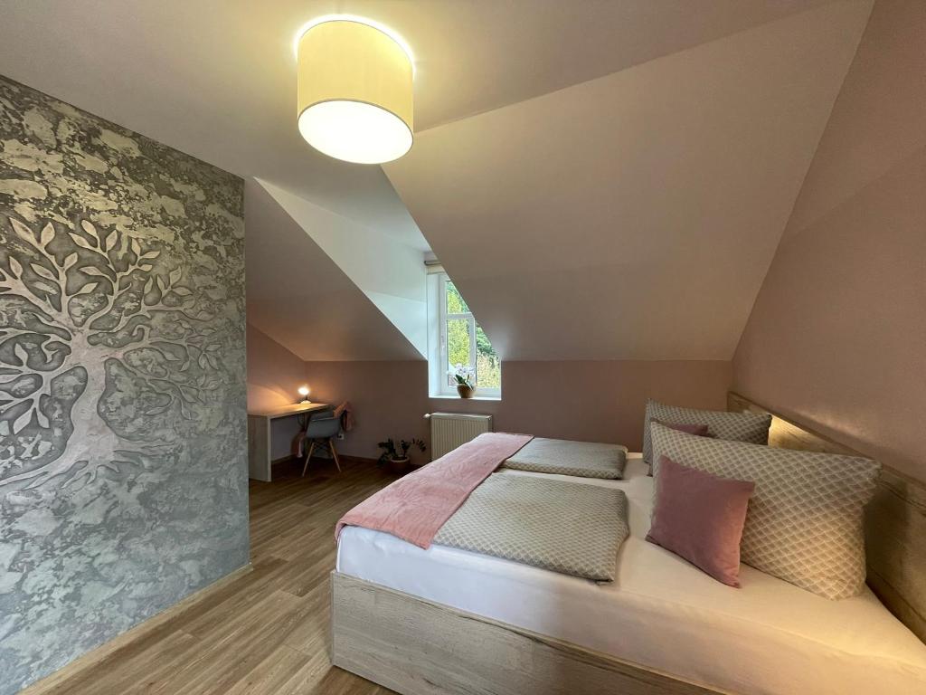 Postel nebo postele na pokoji v ubytování Apartmány Jasmín
