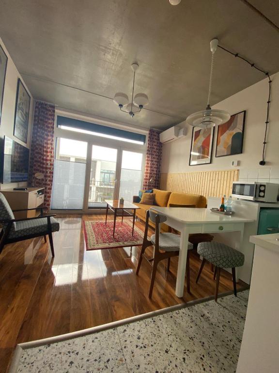 a living room with a table and a couch at Lux Lotnisko in Wrocław