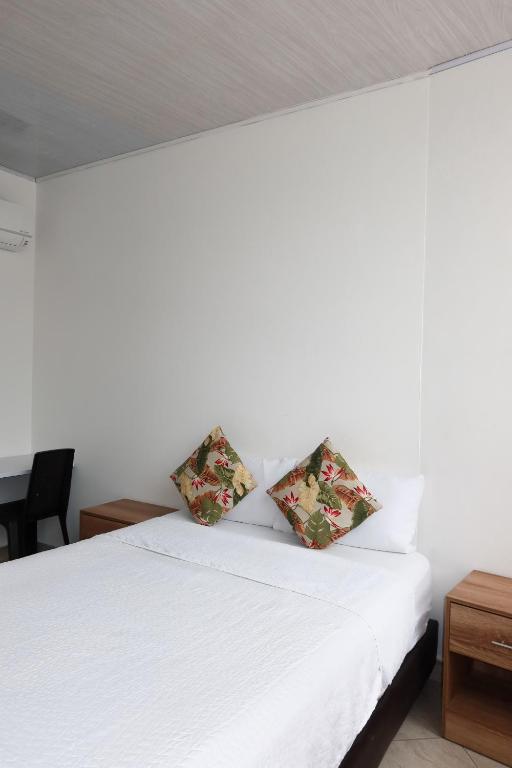 Postel nebo postele na pokoji v ubytování Hotel París