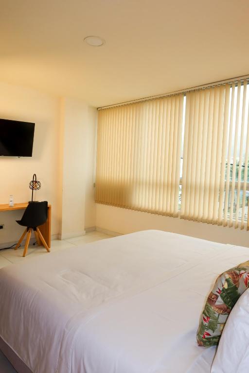 Postel nebo postele na pokoji v ubytování Hotel París