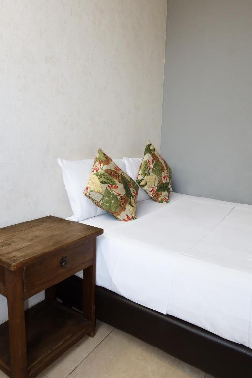 Postel nebo postele na pokoji v ubytování Hotel París