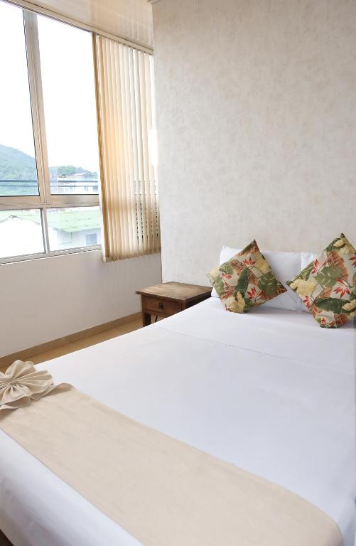 Postel nebo postele na pokoji v ubytování Hotel París