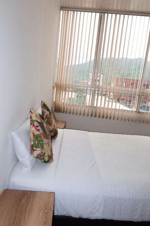 Postel nebo postele na pokoji v ubytování Hotel París