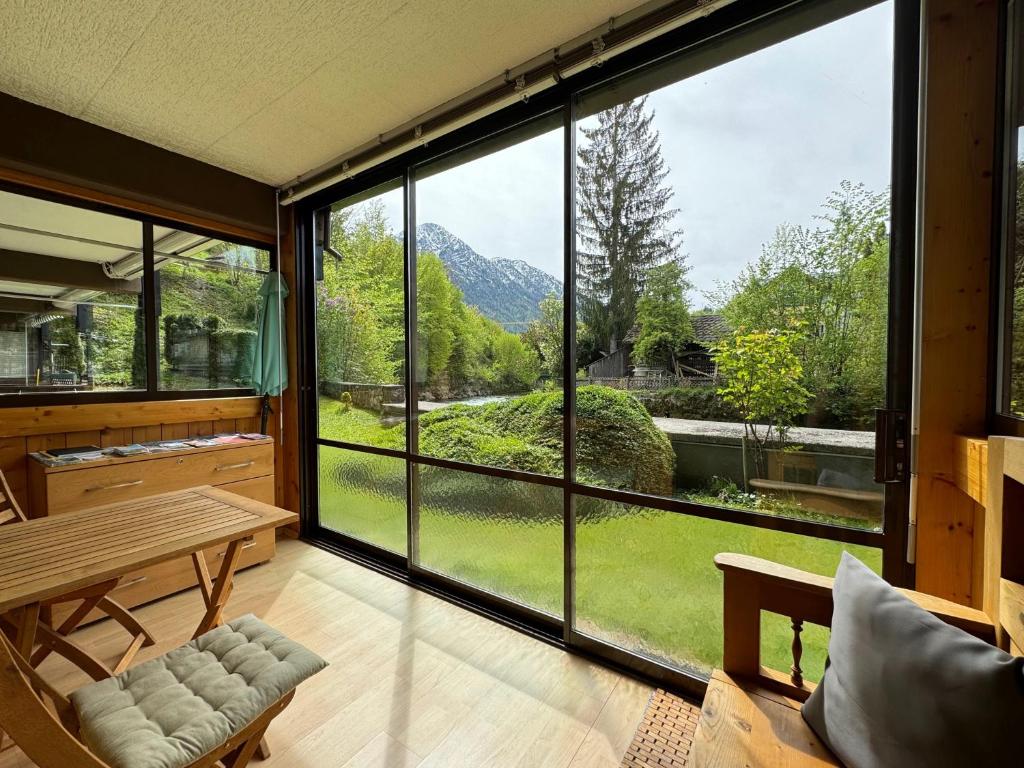 a room with a large window with a view of a mountain at Ferienwohnung an der Traun in Bad Aussee