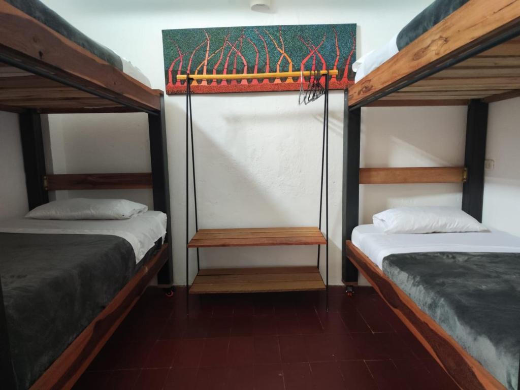 Postel nebo postele na pokoji v ubytování Popichi Hostel