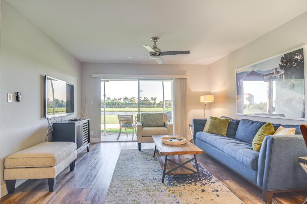 a living room with a couch and a table at Modern Isla Del Sol Condo Walk to St Pete Beach! in St Petersburg