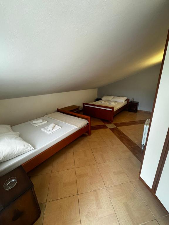 Postel nebo postele na pokoji v ubytování Guesthouse Vila Tamburic