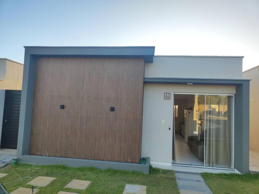 a large garage with a door on the side of it at Casa Aconchegante B in Guanamby