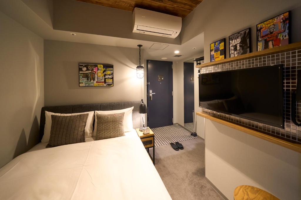 Postel nebo postele na pokoji v ubytování Hotel Resol Akihabara