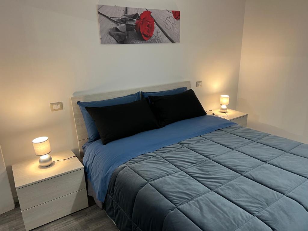 מיטה או מיטות בחדר ב-Appartamento Pilastro Viterbo