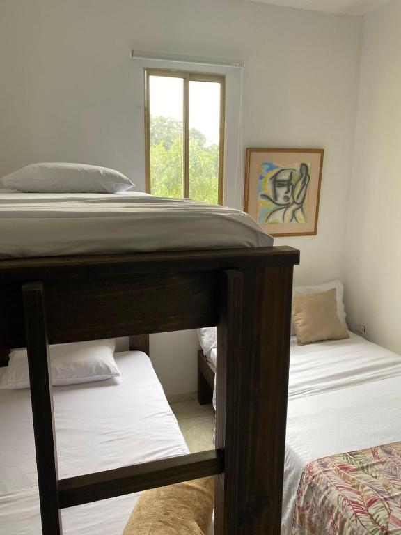 Voodi või voodid majutusasutuse Mahalo Hostel toas