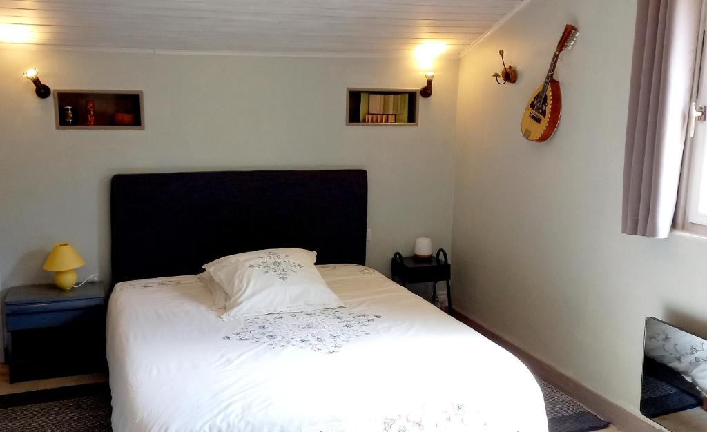 Postel nebo postele na pokoji v ubytování Malpas125 chambres