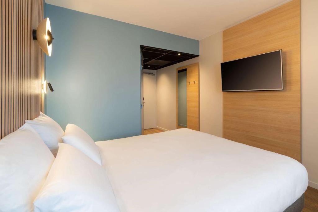 Postel nebo postele na pokoji v ubytování Best Western Bourgoin Jallieu
