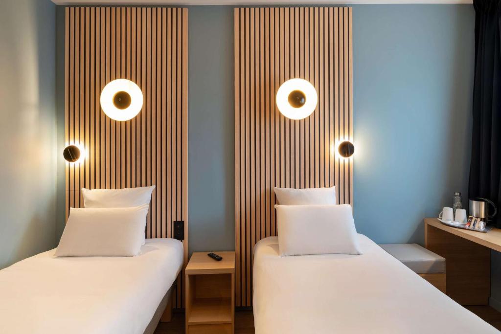Postel nebo postele na pokoji v ubytování Best Western Bourgoin Jallieu