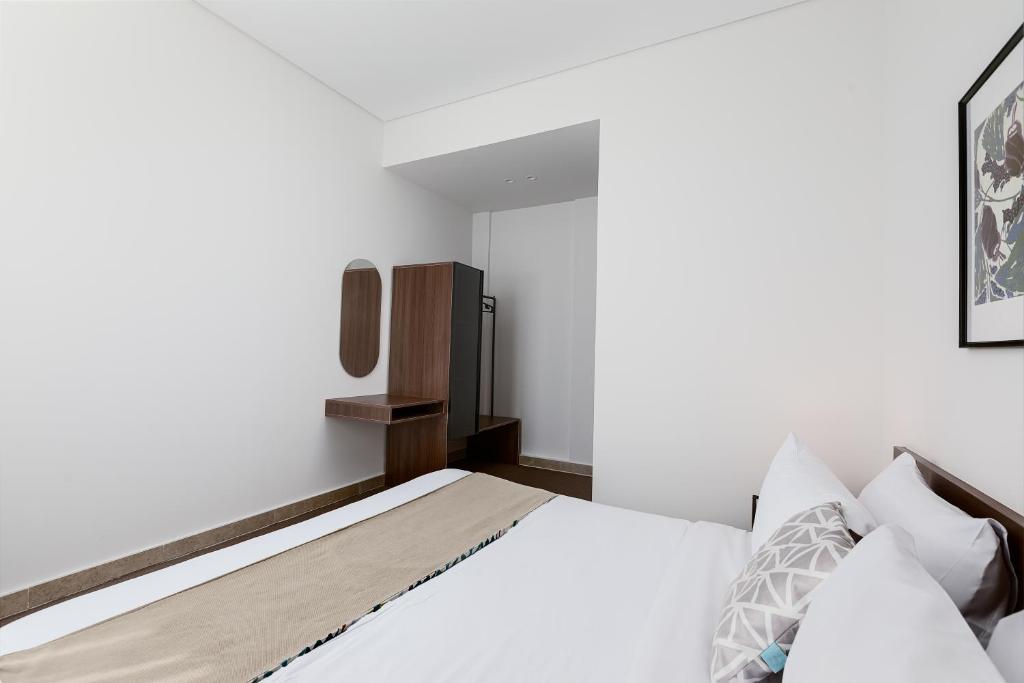 Postel nebo postele na pokoji v ubytování Livingville The Two-Fifty
