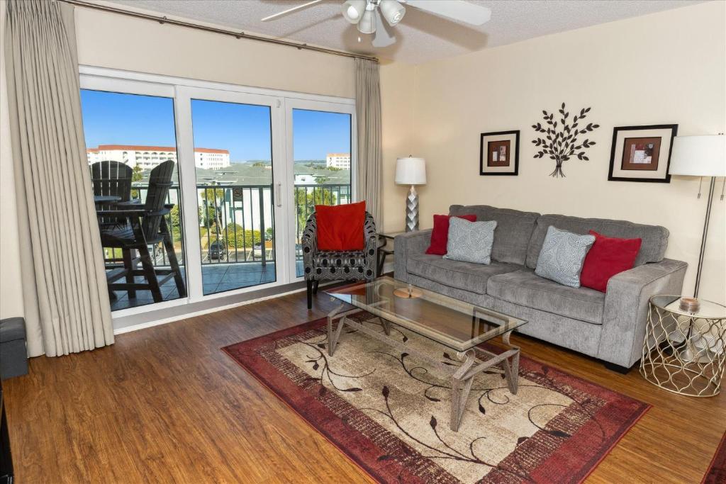 a living room with a couch and a table at SeaCrest 514 condo in Fort Walton Beach